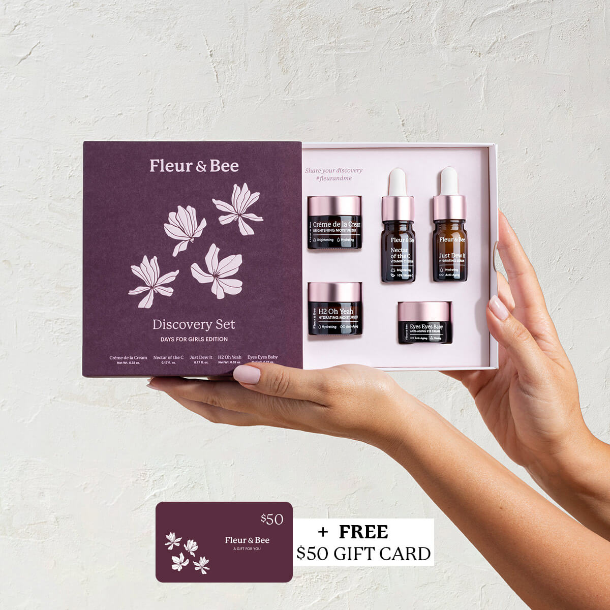 hand holding a skincare gift sate with mini deluxe samples