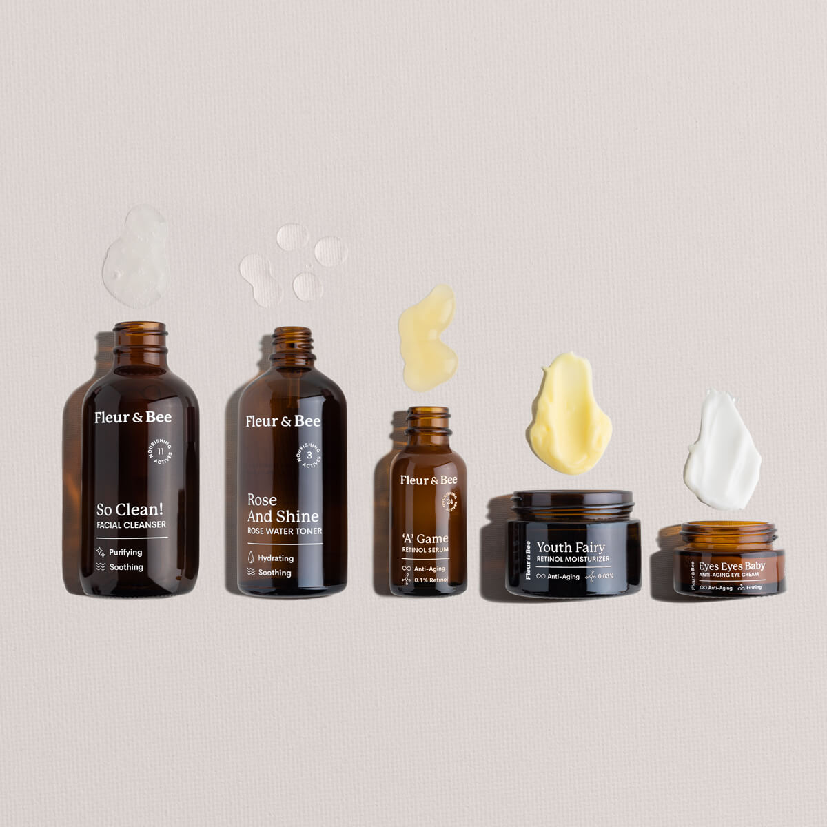 Set of Fleur & Bee skincare products and textures on a neutral background