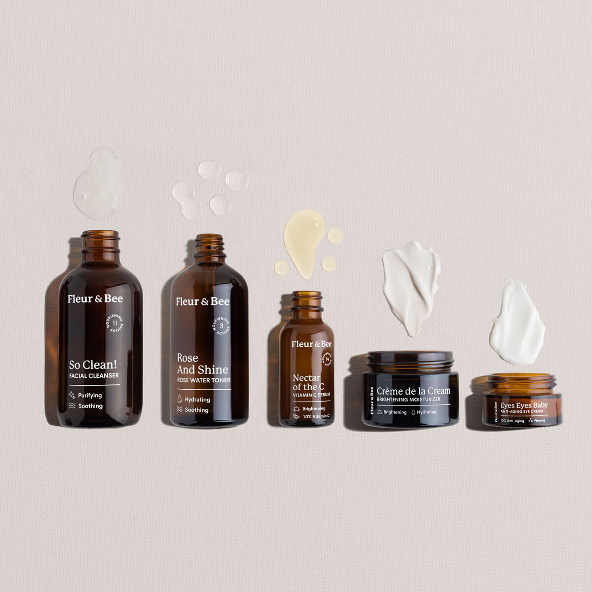 Set of Fleur & Bee skincare products and textures on a neutral background