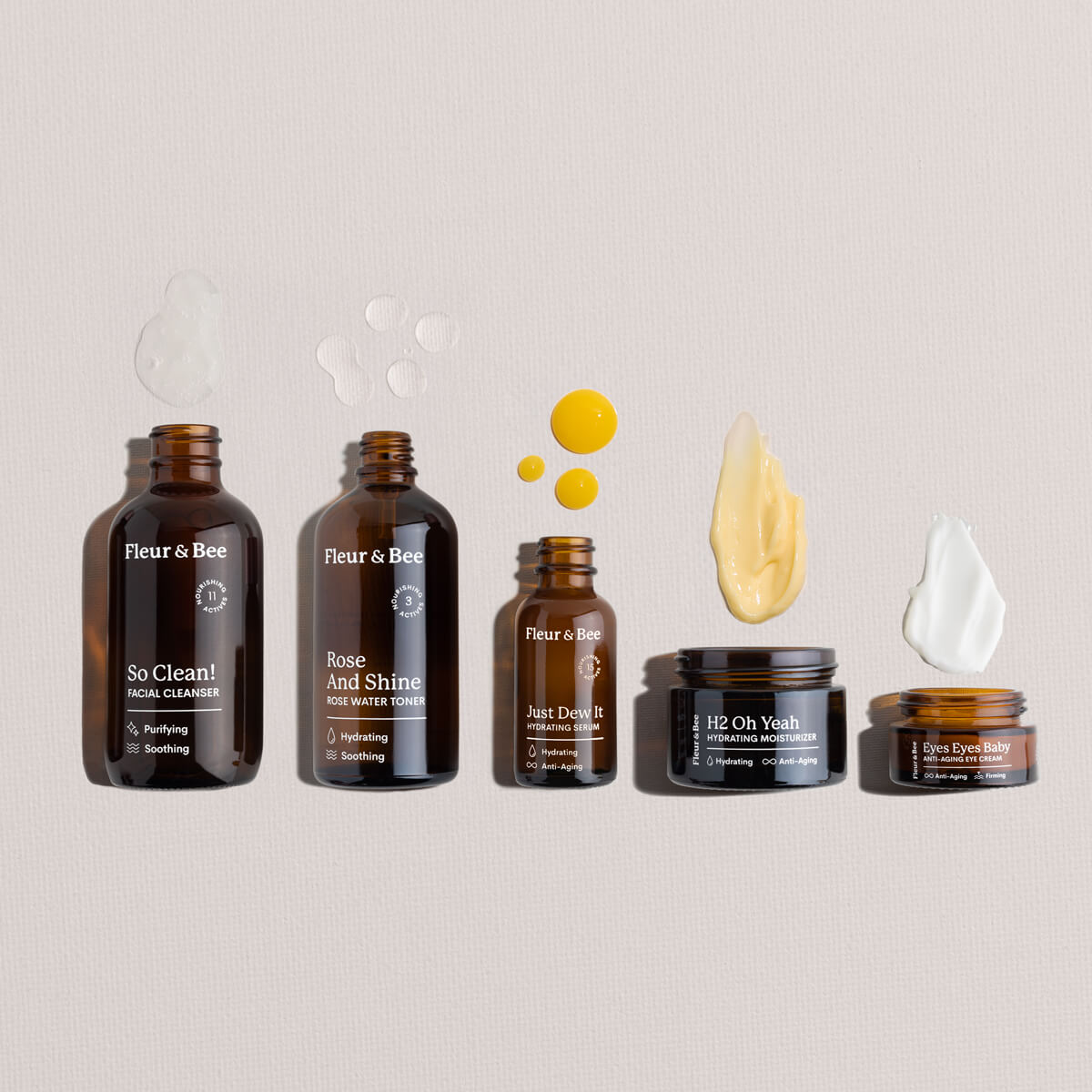Set of Fleur & Bee skincare products and textures on a neutral background