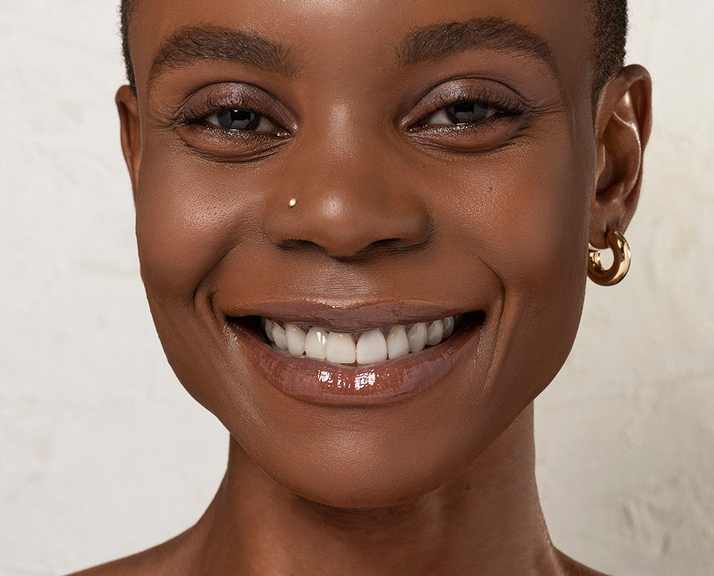 woman with glowing skin smiling