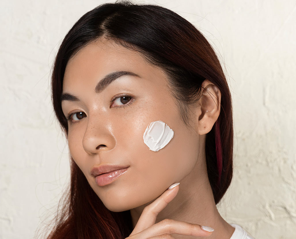 woman with brightening moisturizer applied to her face