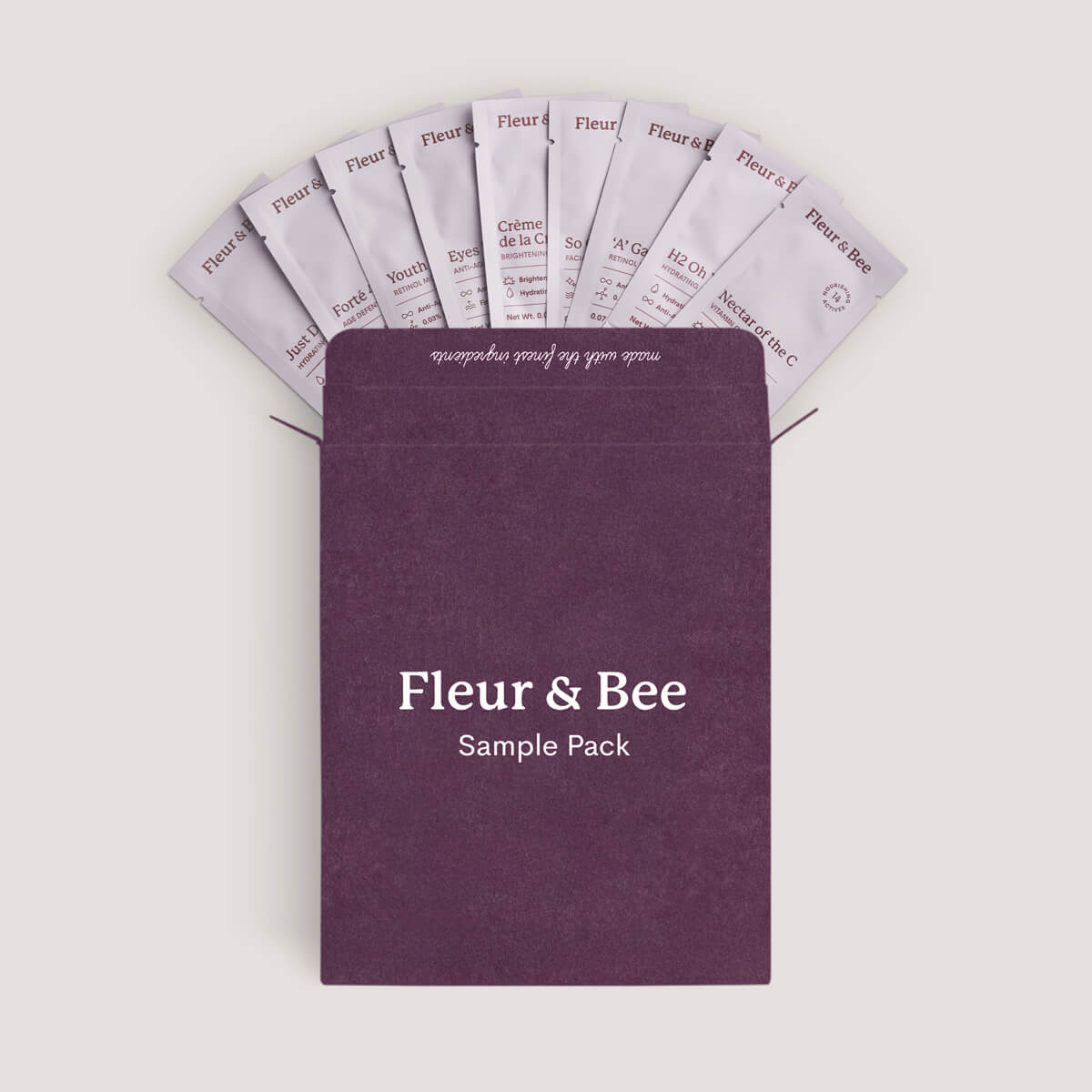 Purple sample pack with 'Fleur & Bee' branding on a light gray background