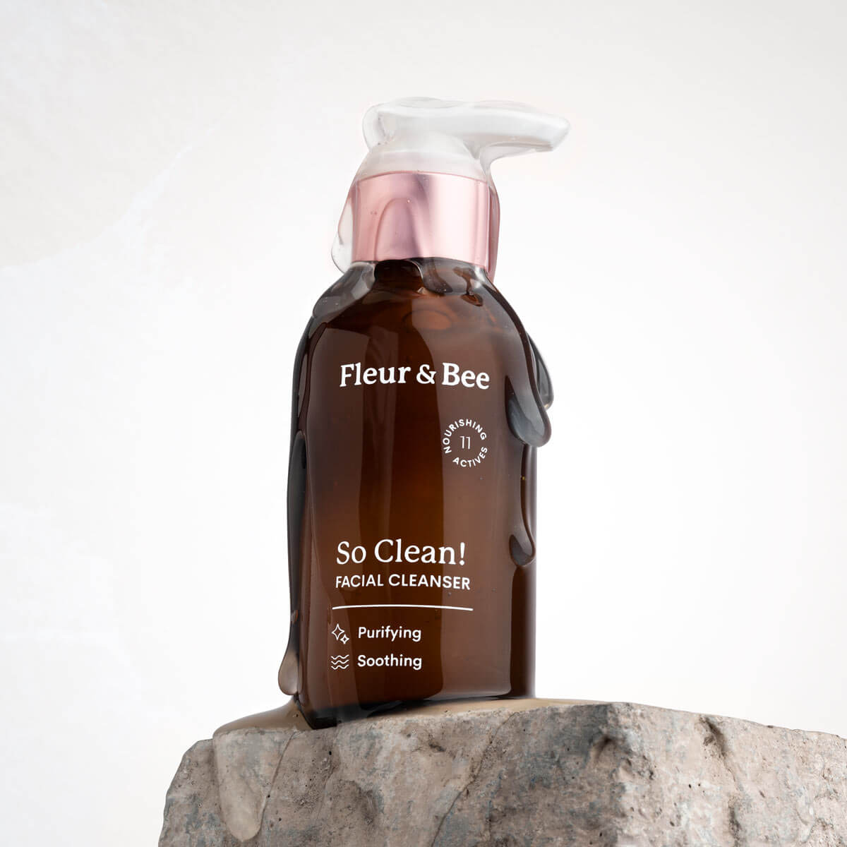 facial cleanser covered in face wash on top of a rock