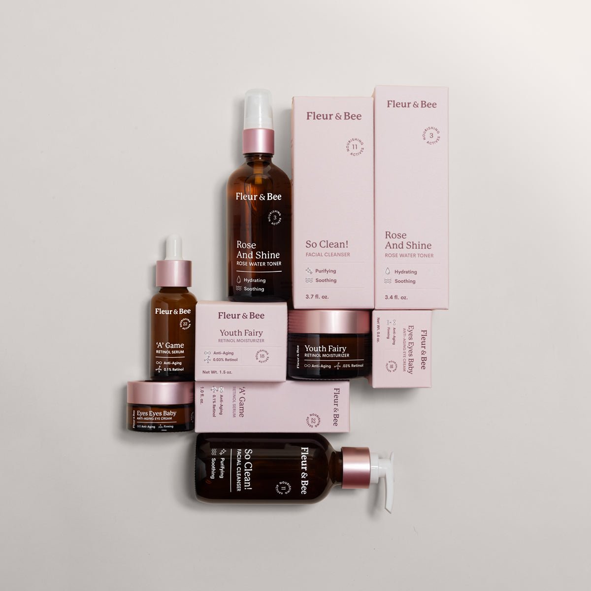 Collection of Fleur & Bee skincare products on a light gray background